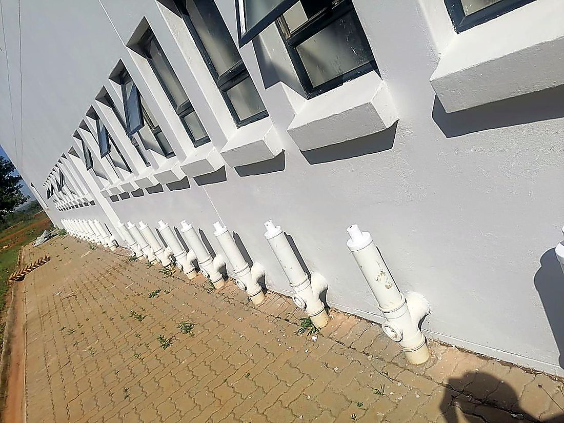 Completed building facade with fire hydrant and service risers after refurbishment