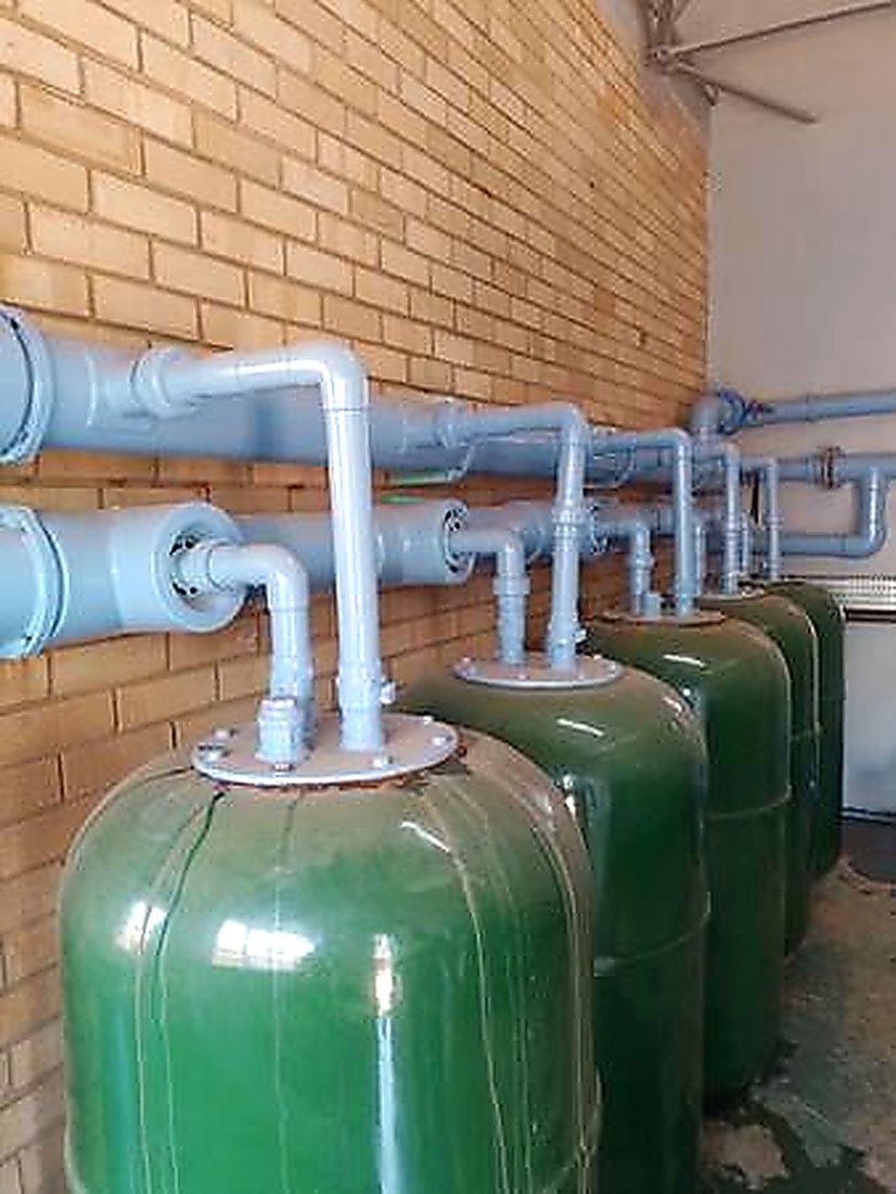 Green pressure filter vessels and manifold pipework in a water treatment plant