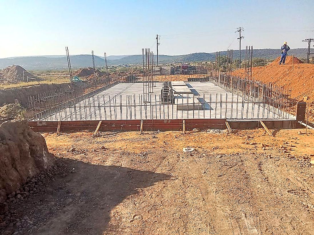 Reinforced concrete base slab with edge formwork set out on a civil works site